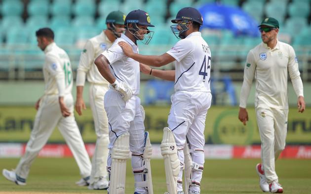 Visakhapatnam: India's Mayank Agarwal is greeted by batsman Rohit Sharma after scoring a maiden century on the 2nd day of the first Test cricket match against South Africa. (PTI)