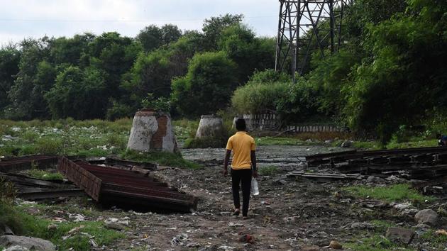 A man walks to defecate in an open area near Hazrat Nizamuddin railway station. Rekha, 26, a mother-of-two who lives in a makeshift tent in the north Delhi district of Bawana, says the nearest toilet facility isn’t working. The other one, she says, costs women three rupees to use. Since she and her husband earn 10-12,000 rupees a month sifting through rubbish, they can’t always afford it. (Prakash Singh / AFP)