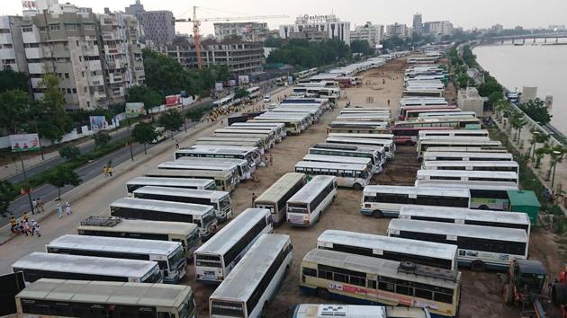 Buses of village heads are seen parked outside the venue of Prime Minister Narendra Modi’s function. The PM made the declaration by pressing the button of a remote, unveiling the map of India as ODF. Simultaneously, the website of the Swachh Bharat Mission- Gramin, which caters to rural India, reported toilet cover to be 100%. (Sam Panthaky / AFP)