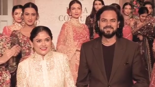 Designer Rahul Mishra with his wife, Divya Bhatt Mishra at the India Couture Week 2019.(FDCI/Instagram)