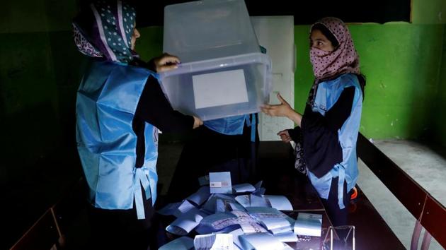 Afghan election commission workers prepare ballot papers for counting of the presidential election in Kabul, Afghanistan. (Mohammad Ismail / REUTERS)