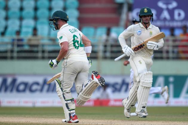 South Africa's Quinton de Kock (R) and Dean Elgar (L) run between the wickets during the third day's play of the first Test match between India and South Africa at the Dr. Y.S. Rajasekhara Reddy ACA-VDCA Cricket Stadium in Visakhapatnam. (AFP)