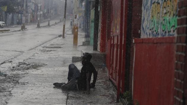 Protestor Jean-Pierre Finfin, 34, shouts for help after being shot in the leg and temporarily abandoned by his friends who had fled police tear gas in Port-au-Prince, Haiti. Demonstrators chanted calls for Haiti’s President Jovenel Moise to resign, the latest in a series of protests aimed at pushing Moise from office. (Rebecca Blackwell / AP)