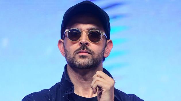 Bollywood actor Hrithik Roshan looks on during the promotion of action thriller Hindi film War.(AFP)