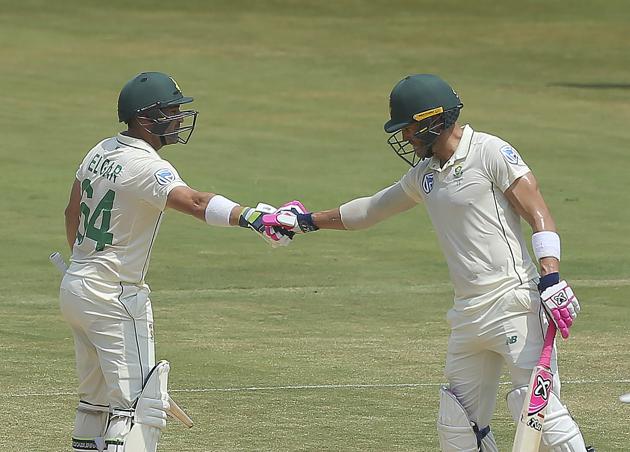 South Africa's Dean Elgar, left, celebrates with captain Fat du Plessis after scoring fifty runs during the third day of the first cricket test match against India in Visakhapatnam. (AP)