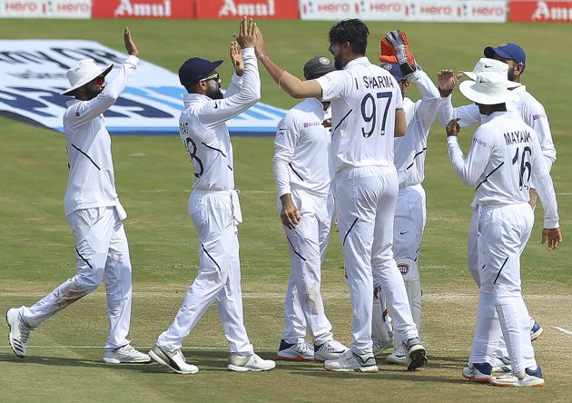 Teammates congratulate Indian bowler Ishant Sharma, centre, for dismissing South Africa's Temba Bavuma during the third day of the first cricket test match against South Africa in Visakhapatnam. (AP)