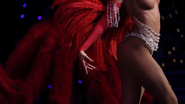 A dancer performs in the review "Feerie" at the Moulin Rouge. Critics say some aspects of the performance – especially the fact that many of the female dancers are topless or wear see-through costumes – is a sexist objectification that is out of step with modern times. (Philippe Wojazer / REUTERS)