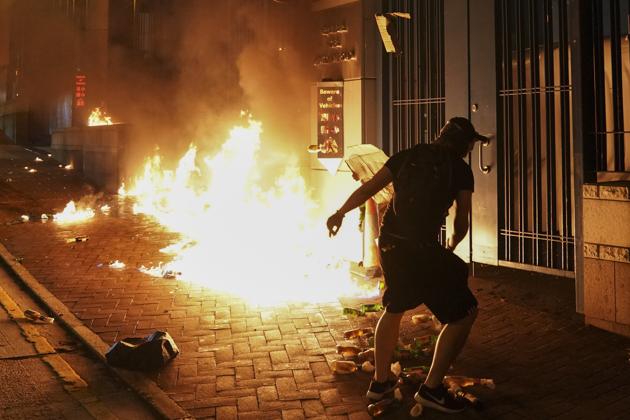 The government’s move comes after activists rampaged across the former British colony in recent months, setting fires, blocking roads and vandalising shops and metro stations. (AP Photo) The government’s move comes after activists rampaged across the former British colony in recent months, setting fires, blocking roads and vandalising shops and metro stations. (AP Photo)