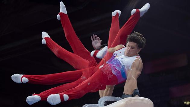 This multi exposure picture shows Russia's Artur Dalaloyan on the pommel horse during a training session for the FIG Artistic Gymnastics World Championships in Stuttgart, southern Germany. (Thomas Kienzle / AFP)
