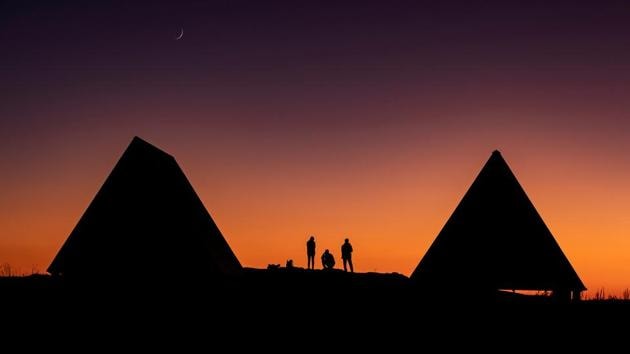 Tourists watch the sunset in the Caucasus mountains outside Krasnaya Polyana near Sochi, Russia. (Maxim Shemetov / REUTERS)