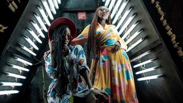 Guests pose prior the 6th Kampala Fashion Week, the annual showcase of fashion brands from East Africa, in Kampala, Uganda. (Sumy Sadurni / AFP)