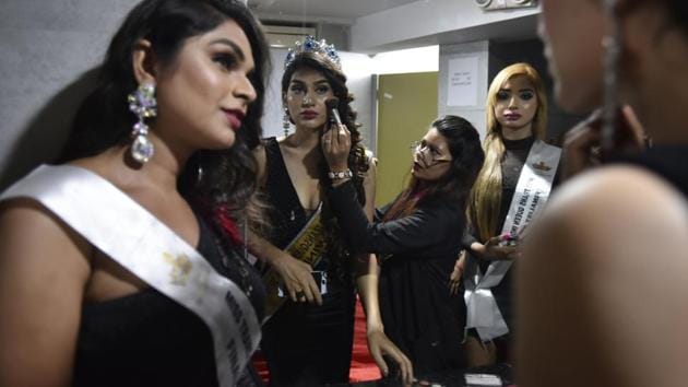 A contestant gets ready for the show. The participants were taught on the nuances of applying cosmetics like foundation, blusher, mascara. They learnt how to make different hairstyles, how to walk the ramp with high heels and to take care of skin and fitness. (Raj K Raj / HT Photo)