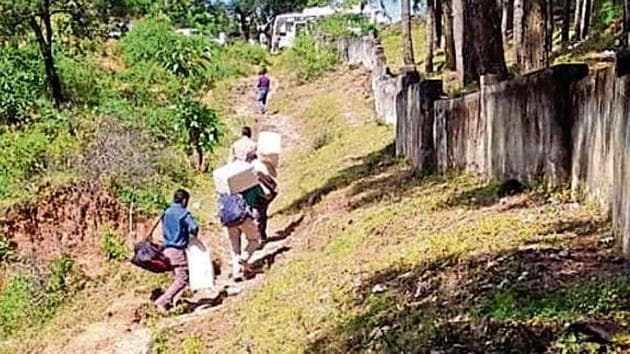 Polling staff on way to Pancheswar, a remote area in Pithoragarh, ahead of the first phase of panchayat polls in Uttarakhand.(HT Photo) Polling staff on way to Pancheswar, a remote area in Pithoragarh, ahead of the first phase of panchayat polls in Uttarakhand.(HT Photo)