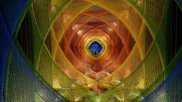 The 69th Durga Puja pandal at Abosor, Bhawanipore is based on the theme ‘bunon’ (knitting). Artist Subrata Banerjee created this with colourful nylon threads, giving it a kaleidoscopic character. (Samir Jana / HT Photo)