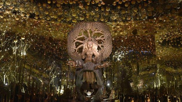 The Durga idol inside the pandal at Barisha Club, Behala. The idol has been made using a single wood by artist Udayshankar Das. (Samir Jana / HT Photo)