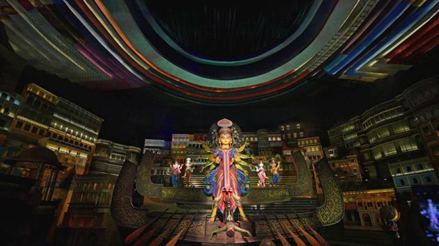 The 82nd Durga Puja pandal at at Kashi Bose lane has ‘existence’ as its theme. Our life depends on water, but the scarcity of water is reaching a prime point. The pandal mirrors this sentiment as Goddess Durga is seen sitting on a boat but the water in the river has dried-up. (Samir Jana / HT Photo)