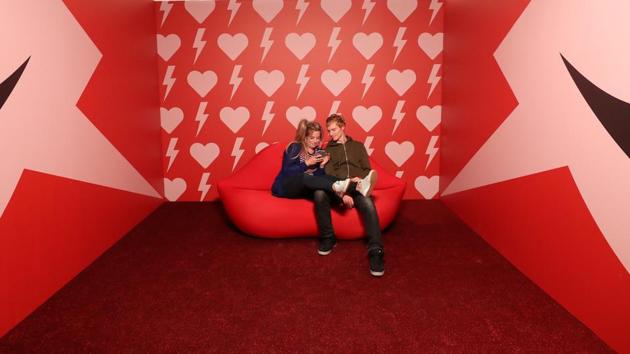 A couple poses for a photo during a visit to the Instagram museum "Smile Safari". (REUTERS)