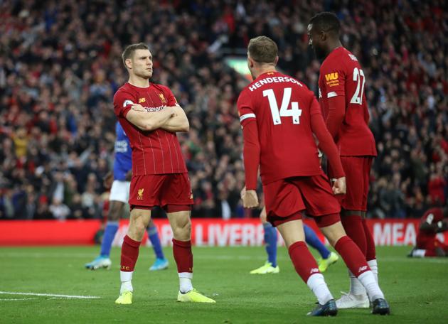 Liverpool's James Milner celebrates scoring their second goal with Jordan Henderson and Divock Origi.(Action Images via Reuters)