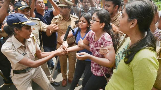 Police detain activists protesting against the felling of trees for the metro car shed project at Aarey Colony in Mumbai. Section 144 of the Criminal Procedure Code was imposed in the colony and surrounding areas on Saturday, banning unlawful assembly following demonstrations. The move to fell trees is a major setback for activists who have been drawing attention to the environmental implications of such action. (Mitesh Bhuvad / PTI)