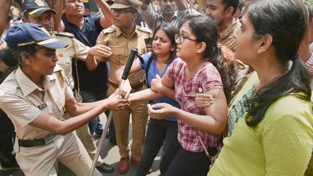 Police detain activists who were staging a protest against the tree-cutting, being carried out for the Metro car shed project, at Aarey colony in Mumbai, Saturday, Oct. 5, 2019.(PTI) Police detain activists who were staging a protest against the tree-cutting, being carried out for the Metro car shed project, at Aarey colony in Mumbai, Saturday, Oct. 5, 2019.(PTI)