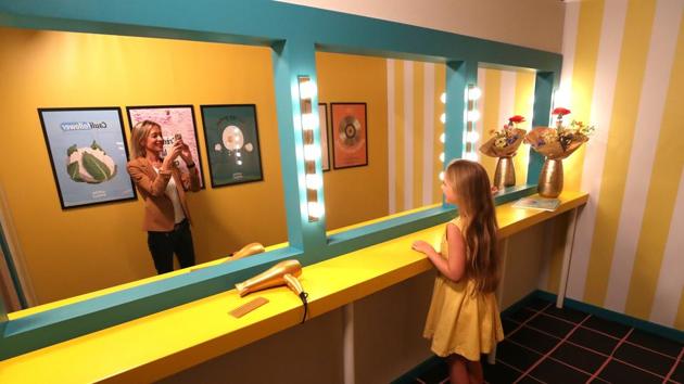 A girl poses for a photo during a visit to the Instagram museum "Smile Safari". (REUTERS)