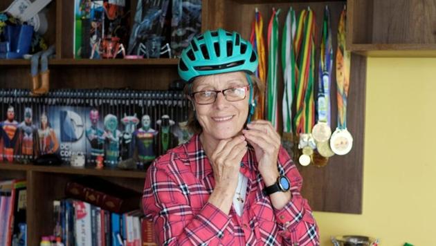 Mirtha Munoz a 70-year-old runner shows her medals at home before the the Sky Race. The route known as "The way of death" to reach 4000 meters in the Andean mountains. (REUTERS) Mirtha Munoz a 70-year-old runner shows her medals at home before the the Sky Race. The route known as "The way of death" to reach 4000 meters in the Andean mountains. (REUTERS)