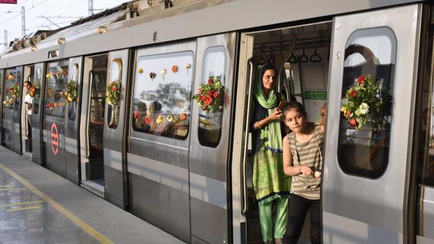 Passengers seen aboard the Delhi Metro’s Grey Line during the inaugural ride, at Najafgarh Metro Station, in New Delhi. (Vipin Kumar / HT Photo)