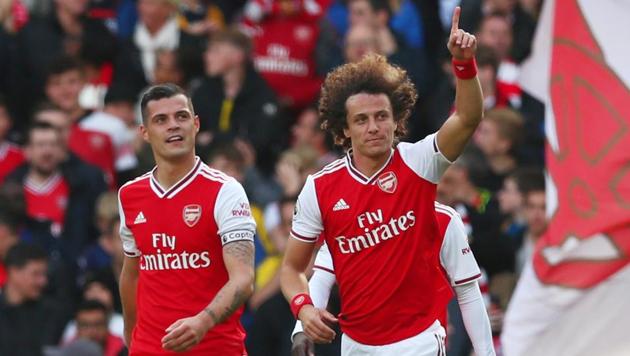 Arsenal's David Luiz celebrates scoring their first goal.(REUTERS)