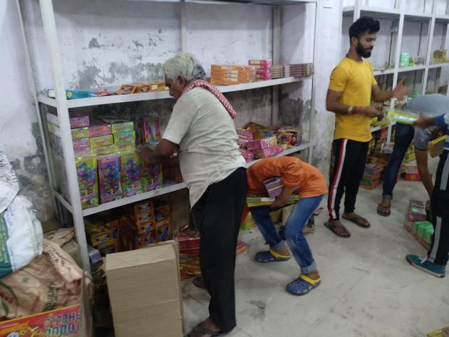 A shop running from a warehouse in Gadoli near Gurugram was selling firecrackers at almost triple the usual price, on Monday, October 7, 2019, a day before the administration enforces the SC ban.(HT Photo)