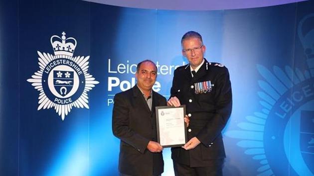 Photo of Sibu Kuruvilla receiving the award from Simon Cole, chief constable of Leicestershire police, at an awards ceremony in Leicester. (leics.police.uk) Photo of Sibu Kuruvilla receiving the award from Simon Cole, chief constable of Leicestershire police, at an awards ceremony in Leicester. (leics.police.uk)