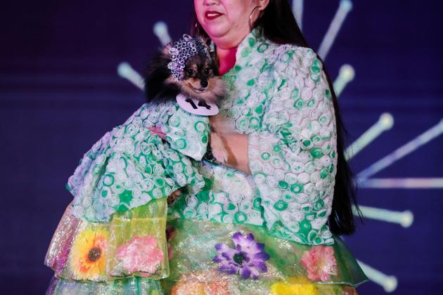 A Pomeranian pet dog dressed like its owner participates at a pet fashion show celebrating World Animals Day in Quezon City, Metro Manila, Philippines, October 6, 2019. (REUTERS/Eloisa Lopez)