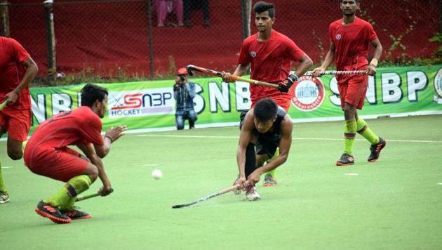 MP (red) vs Odisha (black) in action at 4th SNBP all India hockey tournament at Balewadi in Pune, India, on Sunday,October 06, 2019. (HT PHOTO) MP (red) vs Odisha (black) in action at 4th SNBP all India hockey tournament at Balewadi in Pune, India, on Sunday,October 06, 2019. (HT PHOTO)