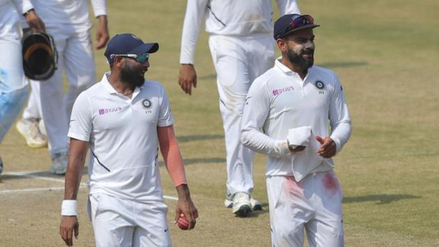 Virat Kohli walking back with Mohammed Shami. (AP) Virat Kohli walking back with Mohammed Shami. (AP)