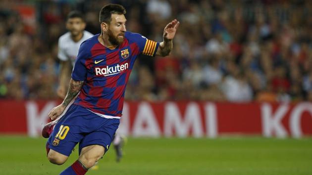 Barcelona's Lionel Messi runs with the ball during Spanish La Liga.(AP)