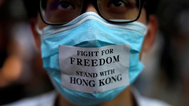“The anti-mask law just fuels our anger and more will people come on to the street,” Lee, a university student wearing a blue mask, said on Sunday, as he marched on Hong Kong island. “We are not afraid of the new law, we will continue fighting. We will fight for righteousness. I put on the mask to tell the government that I’m not afraid of tyranny.” (Jorge Silva / REUTERS)