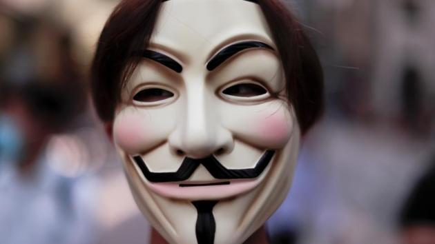 A masked anti-government protester in Central Hong Kong. Tens of thousands of protesters marched through central Hong Kong on Sunday wearing face masks in defiance of colonial-era emergency powers which threaten them with a year in prison for hiding their faces. (Jorge Silva / REUTERS)