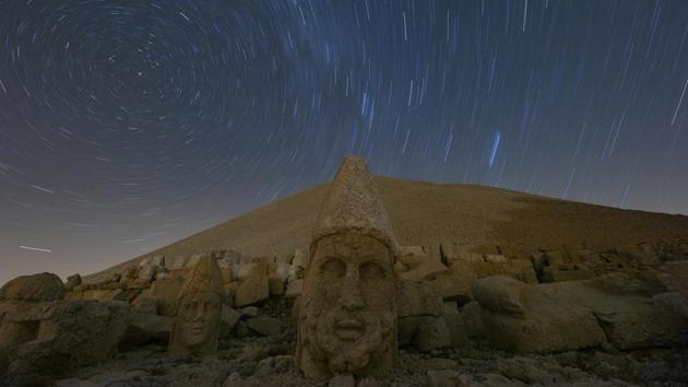 Massive stone head statues are seen at the archaeological site of Mount Nemrut in Adiyaman, southeastern Turkey, a UNESCO World Heritage Site since 1987. The ancient site includes giant 10-meter high, seated statues of King Antiochus I himself surrounded by ancient Gods, including Zeus and Apollo. (Emrah Gurel / AP)