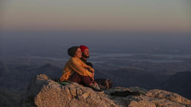 Nesibe Irem Erdem and Faysal Macit, watch the sunset after spending the night at the archaeological site. Visitors climb to the site at dawn or at dusk to see the statues under the spectacular lighting. It’s also a favourite spot for stargazers to watch the night sky. (Emrah Gurel / AP)