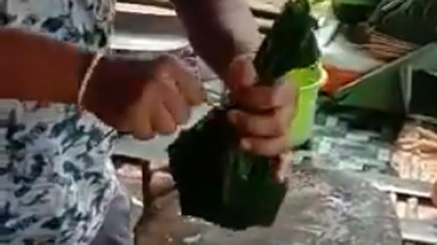 A video posted by Kiren Rijiju on Twitter shows the meat vendor using leaves to pack items instead of using plastic.(Twitter/Kiren Rijiju)