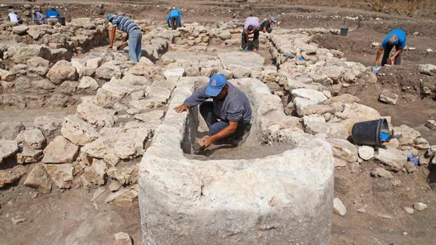 “We have here an immense urban construction, planned with streets that separate neighbourhoods and public spaces,” Yitzhak Paz of the Israel Antiquities Authority said at the site near the Mediterranean in the country’s centre. (Jack Guez / AFP)