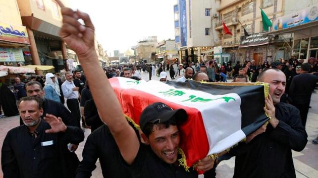 Iraqi men carry the coffin of a demonstrator, who was killed during anti-government protests, at a funeral in Najaf, Iraq. (Reuters Photo)