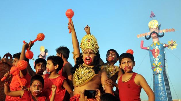 Children dressed as Vanar Sena (Army of monkeys) shout religious slogans during Dusshera celebrations in Jammu. (Nitin Kanotra / HT Photo)