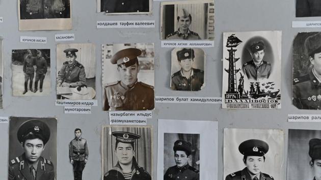 Photos of former students are seen at a school museum. Looking back on her decades-long career, Kuchukova is sad that the school where she worked for more than four decades will soon close its doors for good. “Now it’ll stand there just like in the neighboring villages, not needed by anyone, while people in the city can’t find places for their children at kindergarten and are queuing up from the moment they’re born,” she says. (Alexey Malgavko / REUTERS)