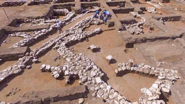 Israeli archaeologists work at the ancient site of En Esur (Ein Asawir) where a 5000-year-old city was uncovered, near the Israeli town of Harish. Archaeologists from the Israel Antiquities Authority said the excavations carried out over the course of two and a half years revealed a city among the biggest from its era in the region, including fortifications, a ritual temple and a cemetery. (Jack Guez / AFP)