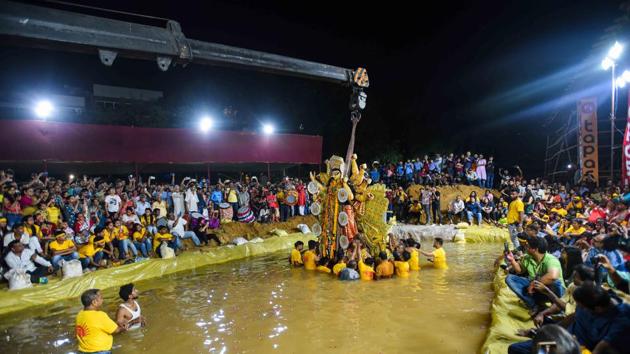 The government and civic agencies dug 116 ponds in Delhi for idol immersion. Many puja committees dug out artificial ponds near the puja venues. (Amal KS/Hindustan Times)