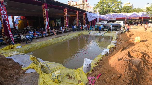 The artificial pond is filled up with water so that devotees can immerse idols of Goddess Durga. (Amal KS/Hindustan Times)