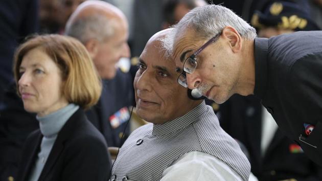 Indian Defense Minister Minister Rajnath Singh, listens to an aide as French Defense Minister Florence Parly, left, listens during a ceremony at the Dassault Aviation plant in Merignac, near Bordeaux.(Photo: AP)