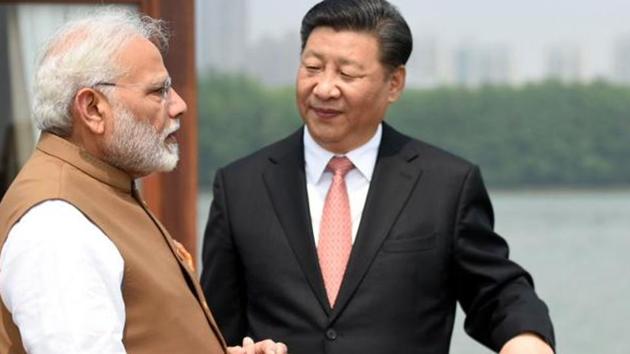 Prime Minister Narendra Modi with China’s President Mr. Xi Jinping inside a house boat in Wuhan’s East Lake, China on April 28, 2018.(File photo)