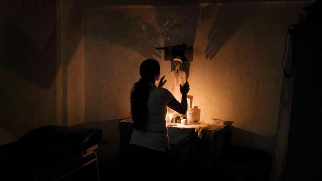 A woman is seen at the clinic of Venezuelan spiritual healer “Guayanese Brother” in Petare neighborhood, Caracas. Venezuelans have turn to alternative treatments and the use of herbs to alleviate the disease conditions due to the lack or high cost of medicines. (Matias Delacroix / AFP)