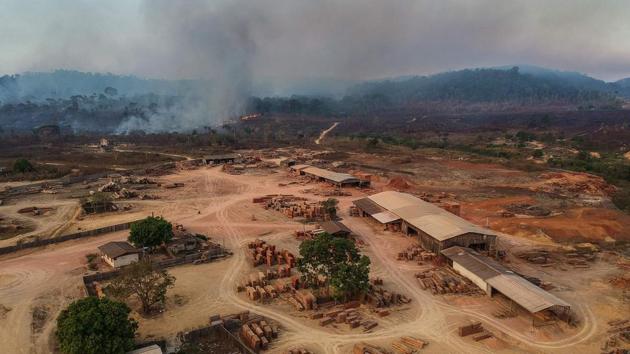 A view of a sawmill in Moraes Almeida town, along a section of the trans Amazonian highyway, in Itaituba. Travel times are worse during the wet season from November to June, when sections of the highways turn into thick mud, or when hundreds of wildcat miners block a highway for days to demand legal status, like they did recently in Moraes Almeida, which straddles the BR163. (Nelson Almeida / AFP)